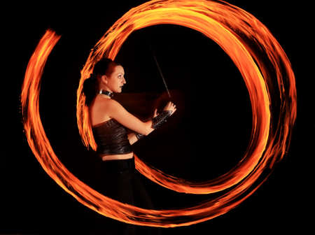 Woman holds in his hand the fireの写真素材
