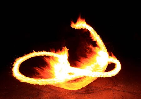 Fire show flaming trails, background.の写真素材