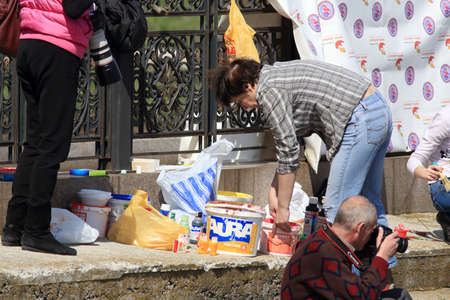 DONETSK - APRIL 11: Group of artists painted on the waterfront Easter basket in Donetsk. April 9, 2015のeditorial素材