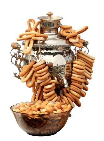 Russian samovar with bagels on the white background, isolate.の写真素材