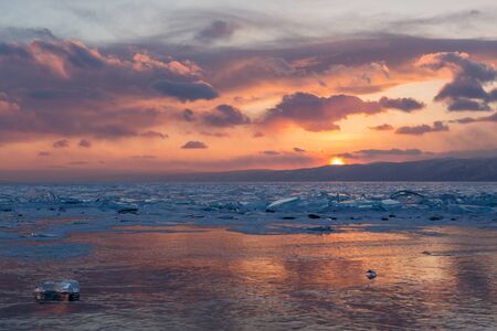 Sunset in the icy Lake Baikal, Irkutsk region, Russia.の写真素材