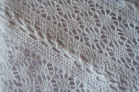 Close up of white bone lace fabricの写真素材