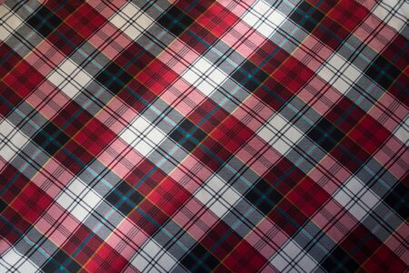 checked plaid fabric in red, black and white from aboveの写真素材