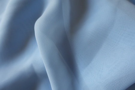 Draped lightweight sky blue polyester chiffon clothの写真素材