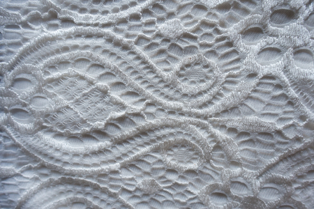 Close up of white openwork lace fabricの写真素材