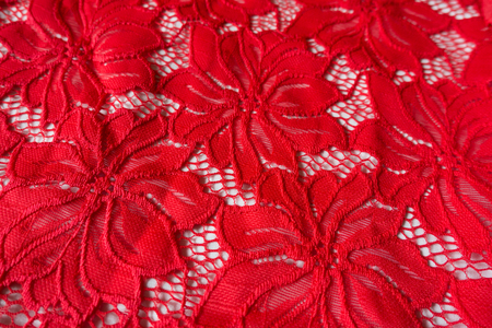 Red lace with floral pattern on white backgroundの写真素材