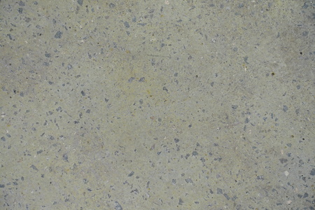 Pale yellow flat grey concrete slab from aboveの写真素材