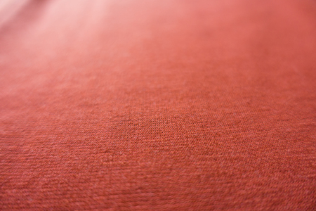 Soft focus coral colored jersey fabric backgroundの写真素材