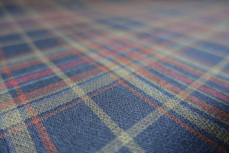 Macro of plaid fabric in subdued colors