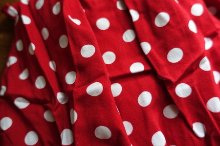 Crumpled red cotton with polka dot patternの写真素材