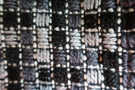 Checkered embroidered thick grey fabric from above