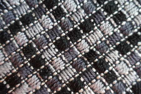 Gray fabric with diagonal stitches from above