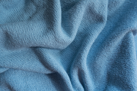 Folded sky blue fabric without prints or patterns