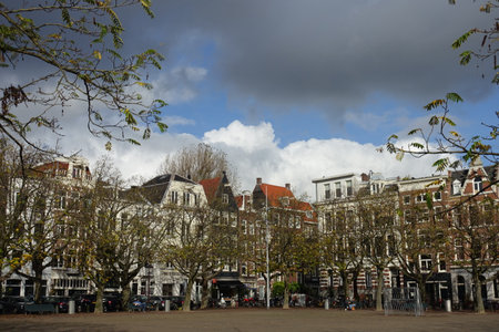 Square in Amsterdam, Netherlands on cloudy dayのeditorial素材