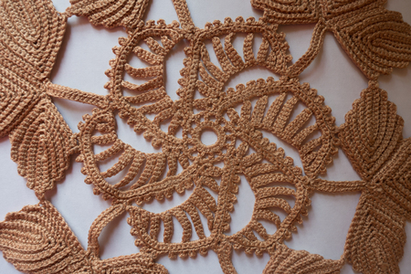 Detail of handmade beige doily from above
