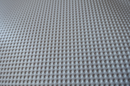Closeup of white material with embossed polka dotsの写真素材