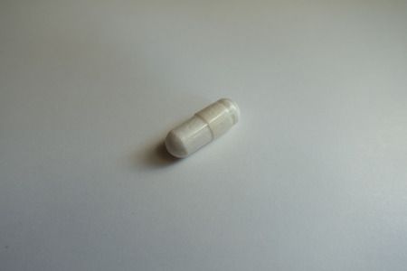 Close shot of white magnesium citrate capsule