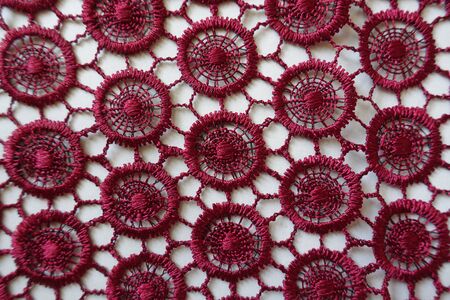Carmine red lacy fabric directly from aboveの写真素材