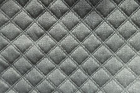 Quilted white fabric with diamonds pattern from aboveの写真素材