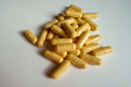 Group of orange cellulose capsules of multivitaminsの写真素材