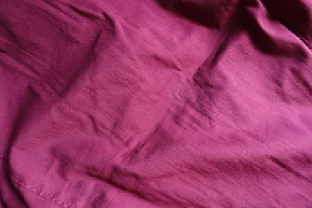 Reddish rose viscose fabric in soft foldsの写真素材