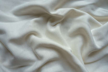 Unprinted simple white cotton jersey fabric in soft folds