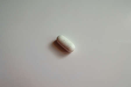 One white caplet of kelp dietary supplementの写真素材