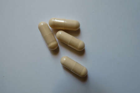 Group of four beige capsules of milk thistle extractの写真素材