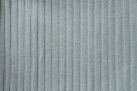 Texture of simple white ribbed cotton fabric from above