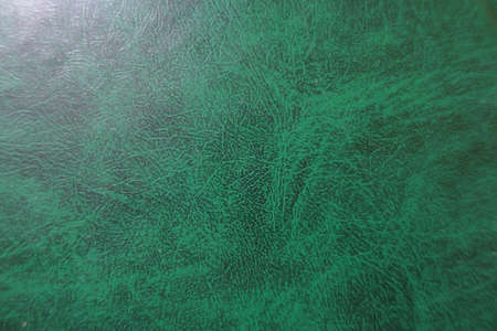 Dark green faux leather material from above