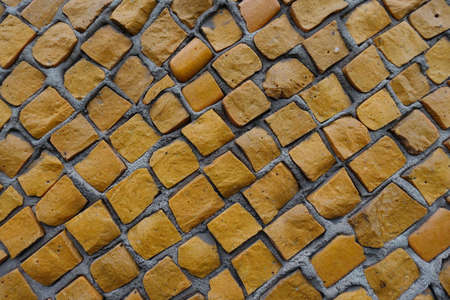 Background - texture of bright orange mosaic wallの写真素材