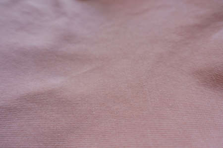 Closeup of light pink cotton jersey fabric