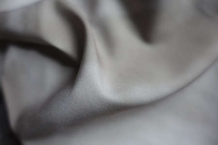 Closeup of viscose and polyester fabric with tie dye pattern in shades of grayの写真素材