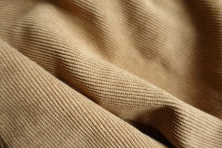 Closeup of folded light brown corduroy fabricの写真素材