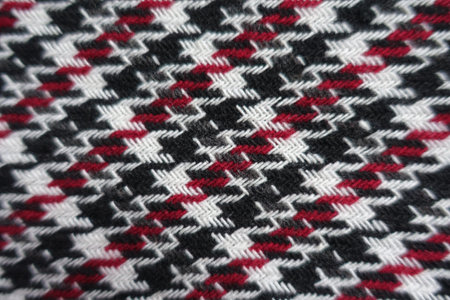 Surface of thick black, red and white woolen twill fabricの写真素材