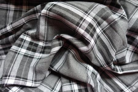Draped gray, black and white cotton flannel tartan fabricの写真素材