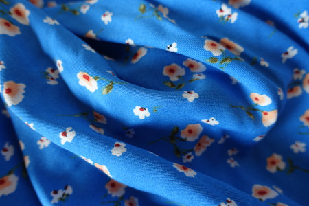 Rippled vibrant blue cotton fabric with old fashioned floral print