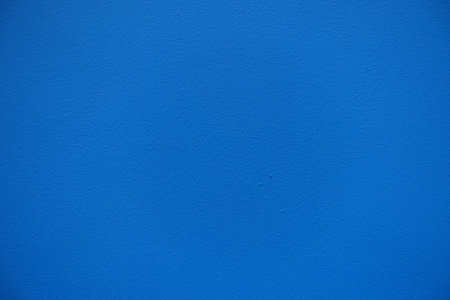 Closeup of bright electric blue painted wall