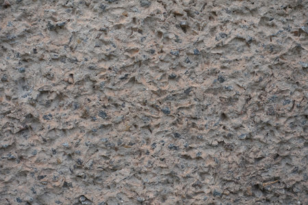 Macro of gray wall with unpainted cement roughcast finishの写真素材