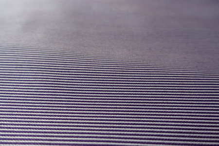 Close view of purple and white striped cotton fabric