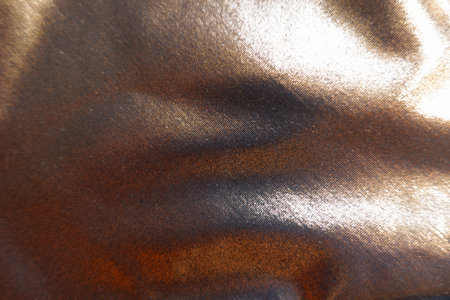 Texture of shiny bronze nylon and spandex lame fabricの写真素材