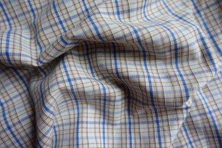 Rippled white, blue and brown checkered cotton fabric