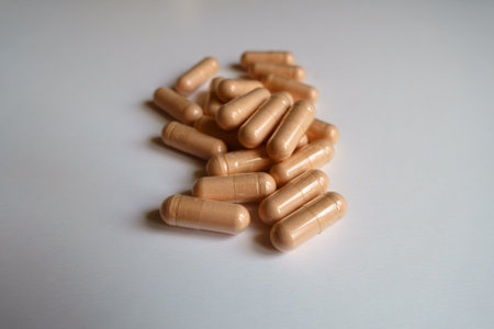 Close view of heap of pink capsules of palmitoylethanolamide dietary supplement