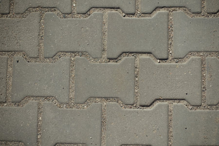 Close shot of gray concrete interlocking pavement