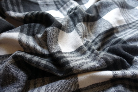 Draped black and white checkered cotton flannel fabric