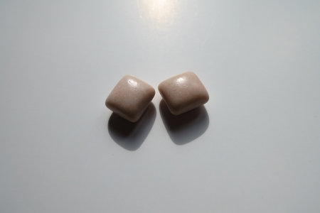 Close view of two rectangular pieces of chewing gumの写真素材
