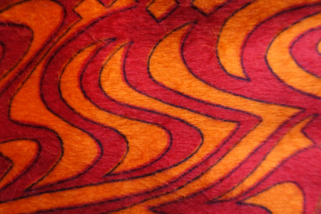 Closeup of red and orange pile fabricの写真素材