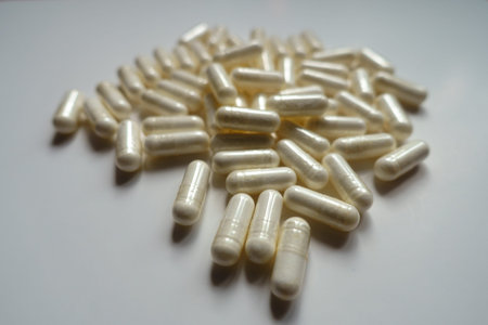 Close shot of heap of white capsules of melatonin dietary supplement