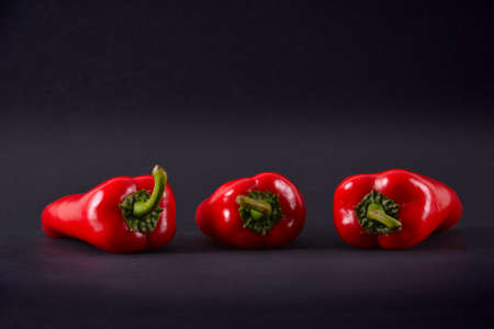 Red peppers on a black background. Ajvarの写真素材