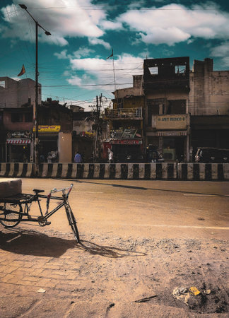 Urban Street Scene with Rickshaw and Buildings in Ranchi, Jharkhandの写真素材